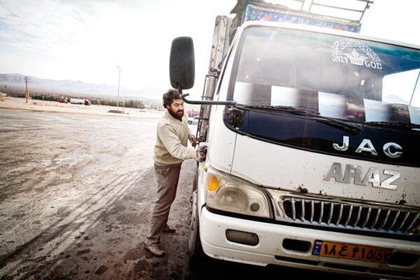 Driver cleaning his lorry in western Iran. Photo Johanna Henriksson.